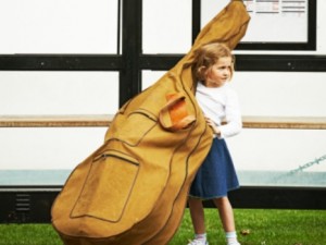 Girl at bus stop with cello case